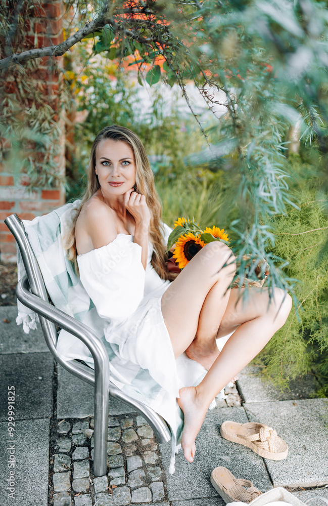 photo in Italian style with a sexy young woman in a light summer dress a peasant woman picking fruits