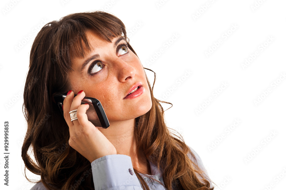 Businesswoman on a phone call looking thoughtful Businesswoman on a phone call looking thoughtful
