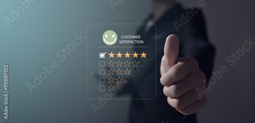 satisfaction survey concept Businessman's hand selects a smiley face on a wooden circle. 5 star satisfaction, customer service