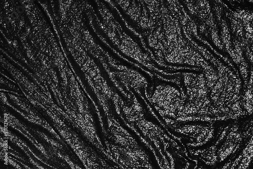 Abstract black background. Dark textured background. Black background with wavy texture. Wet black cloth texture