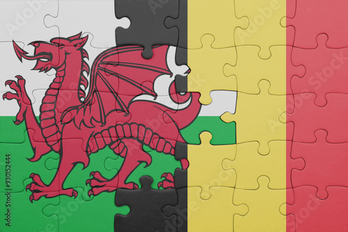 puzzle with the colourful national flag of belgium and flag of wales . photo