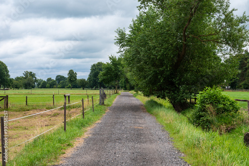 Gravel cycling trail through the nature park of the Fischerhuder Wümmeniederung, Lower Saxony, Germany