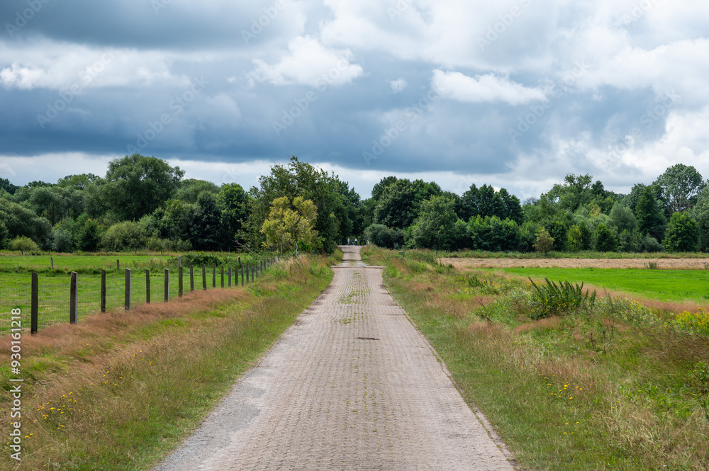 Cycling trail through the fields of the German countryside around Bredenau, Lower Saxony, Germany Cycling trail through the fields of the German countryside around Bredenau, Lower Saxony, Germany