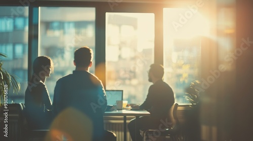 A team engages in a productive discussion in a bright office filled with natural light