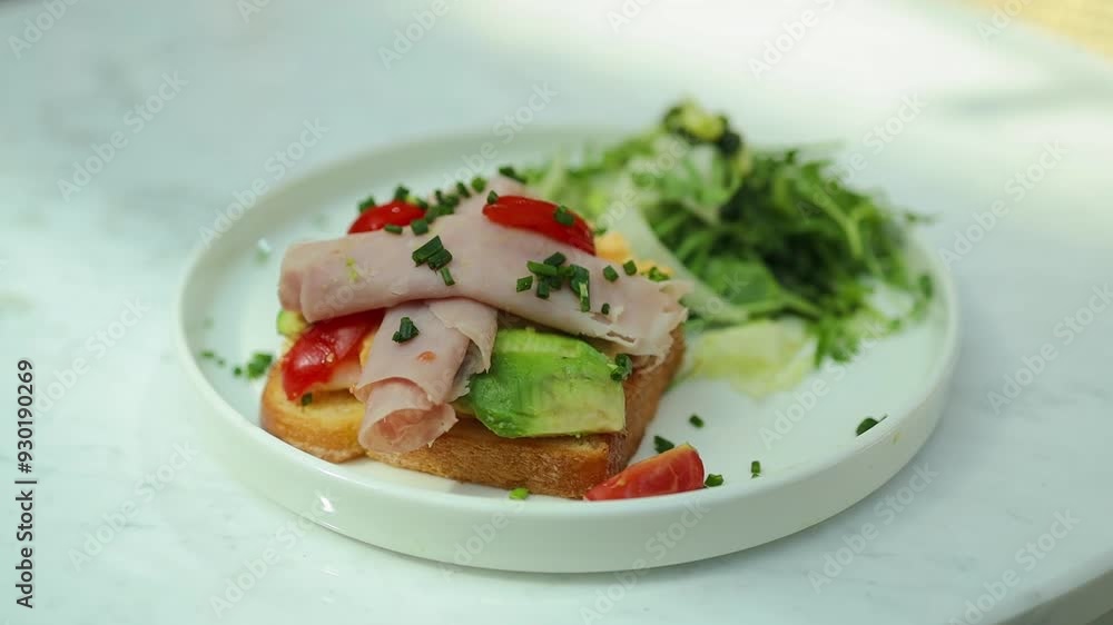 Morning eco breakfast toast with bacon, avocado and egg on a plate at city cafe. Healthy food. High quality FullHD footage Morning eco breakfast toast with bacon, avocado and egg on a plate at city cafe. Healthy food. High quality FullHD footage
