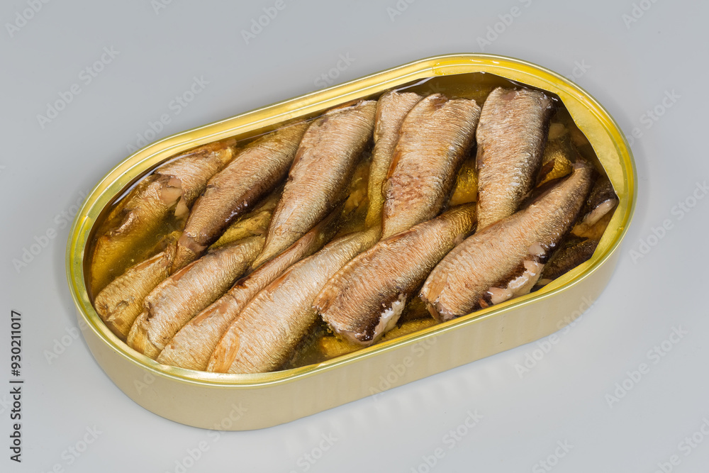 Smoked sprats without heads in cooking oil in tin can Smoked sprats without heads in cooking oil in tin can