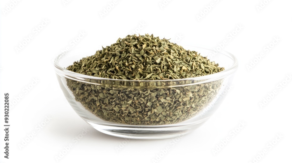 A glass bowl of dried oregano seasoning, isolated on a white background, with a clean and simple composition emphasizing the freshness of the dried herb. A glass bowl of dried oregano seasoning, isolated on a white background, with a clean and simple composition emphasizing the freshness of the dried herb.
