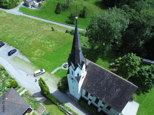 Aerial view of Kuratienkirche Meschach surrounded by lush greenery. Gotzis, Austria photo