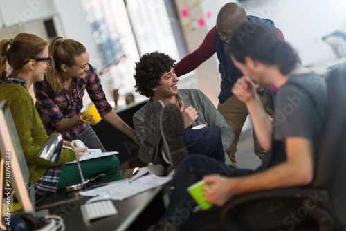 Team of architects collaborating on project in modern office