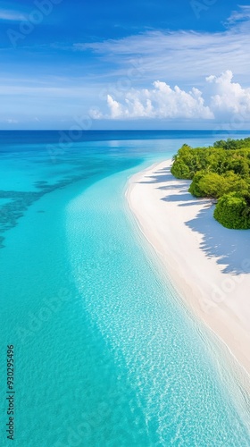 Aerial of a pristine ocean coastline with crystal-clear turquoise waters lapping against white sandy beaches and a coral reef visible beneath the surface