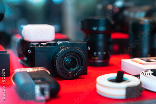 Black design mirrorless camera. Cameras behind the shop window. Photographer's equipment.