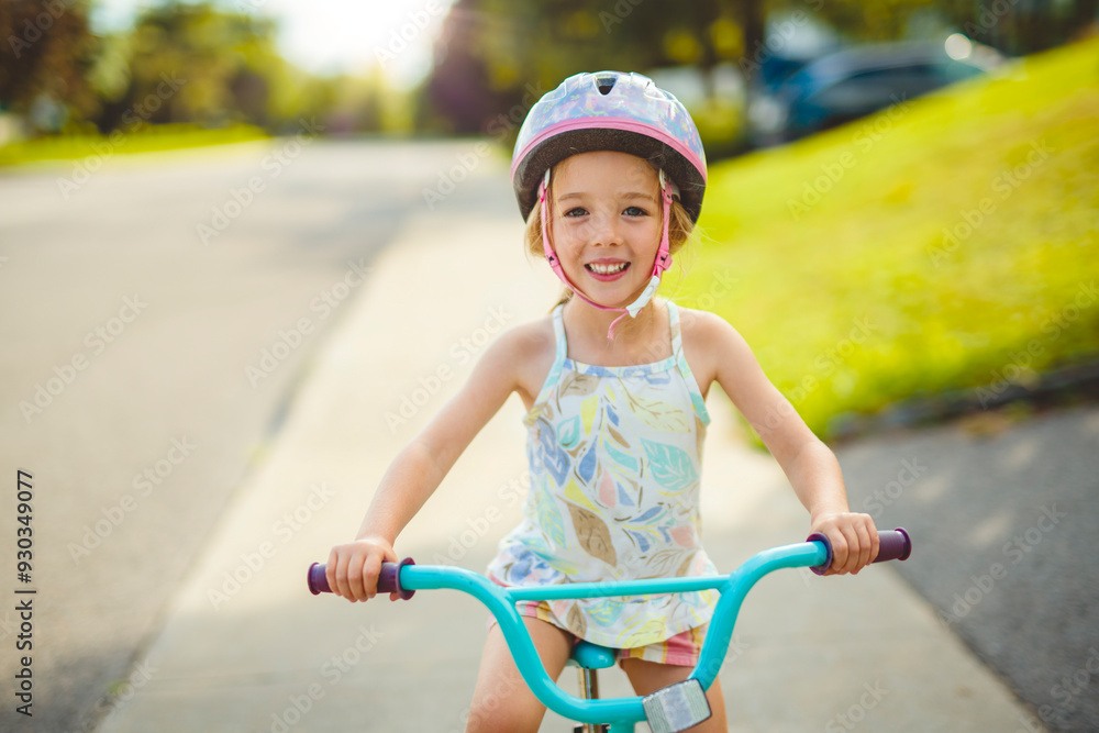 kid girl of 4 years having fun when cycling on the bicycle kid girl of 4 years having fun when cycling on the bicycle