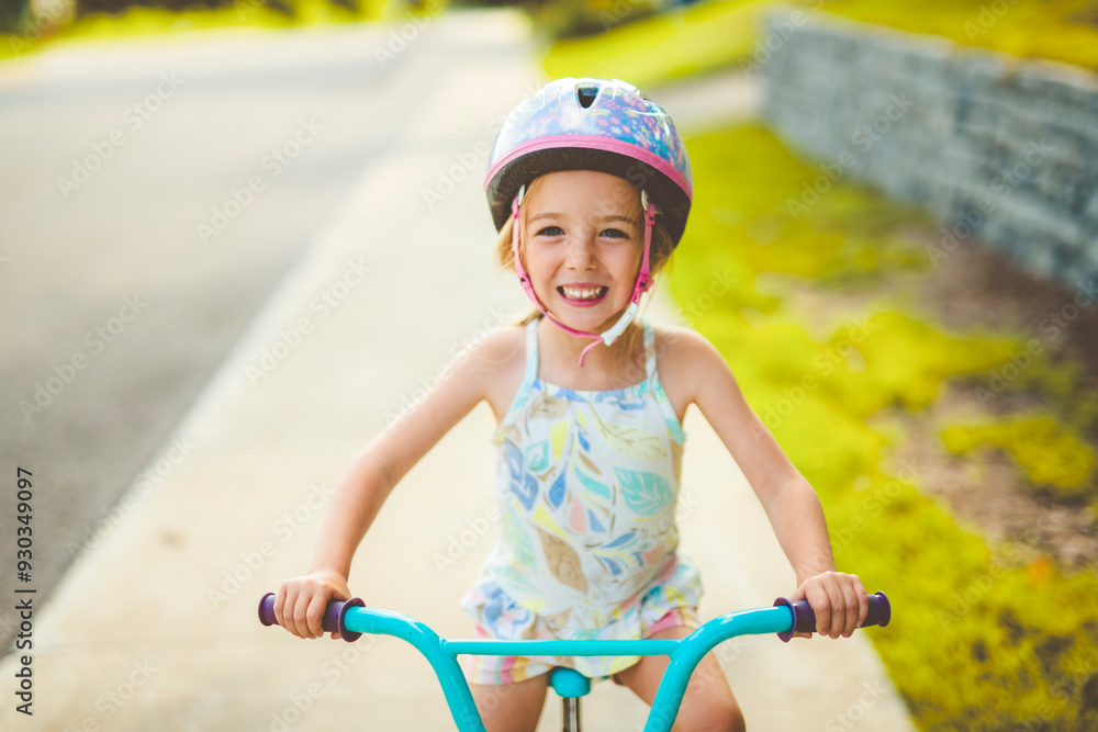 kid girl of 4 years having fun when cycling on the bicycle kid girl of 4 years having fun when cycling on the bicycle