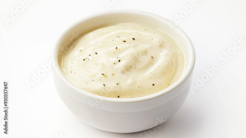 creamy Caesar dressing with a smooth, pale texture and flecks of Parmesan cheese