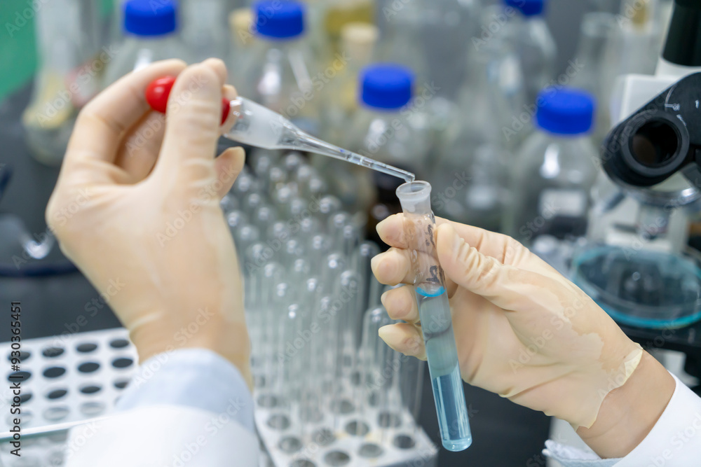 In the chemistry lab, scientists are doing chemical experiments with test tubes In the chemistry lab, scientists are doing chemical experiments with test tubes