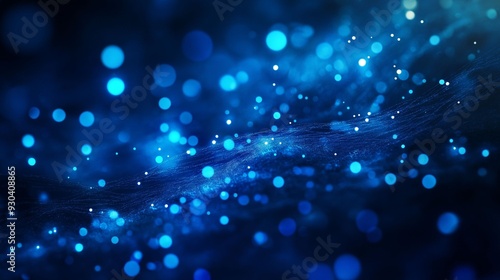 Abstract digital background featuring smooth, flowing blue waves and scattered glowing particles.