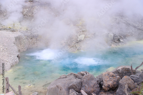 Vibrant Geothermal Pool Amidst Volcanic Terrain in Tamagawa Onsen, Akita, Japan