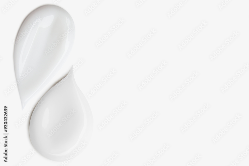 Smears of white cosmetic cream on a light background. Smears of white cosmetic cream on a light background.