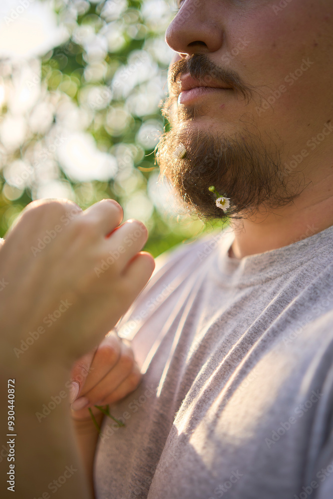 the wife weaves flowers into her husband's beard