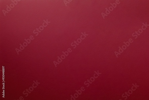 Rich burgundy leather texture background with a luxurious, smooth surface. The deep red tone adds elegance and sophistication to various design projects.