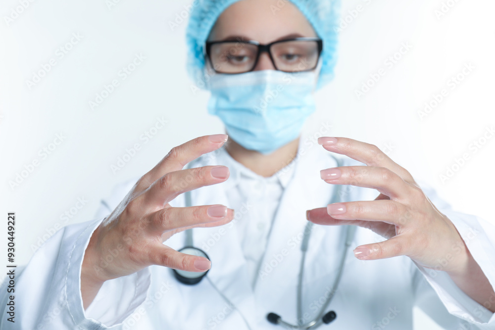 Doctor holding something on white background, selective focus Doctor holding something on white background, selective focus