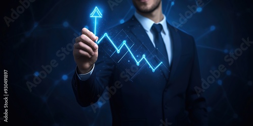 A businessman pointing at a glowing digital upward graph, showcasing growth and success amidst a dark technological background.