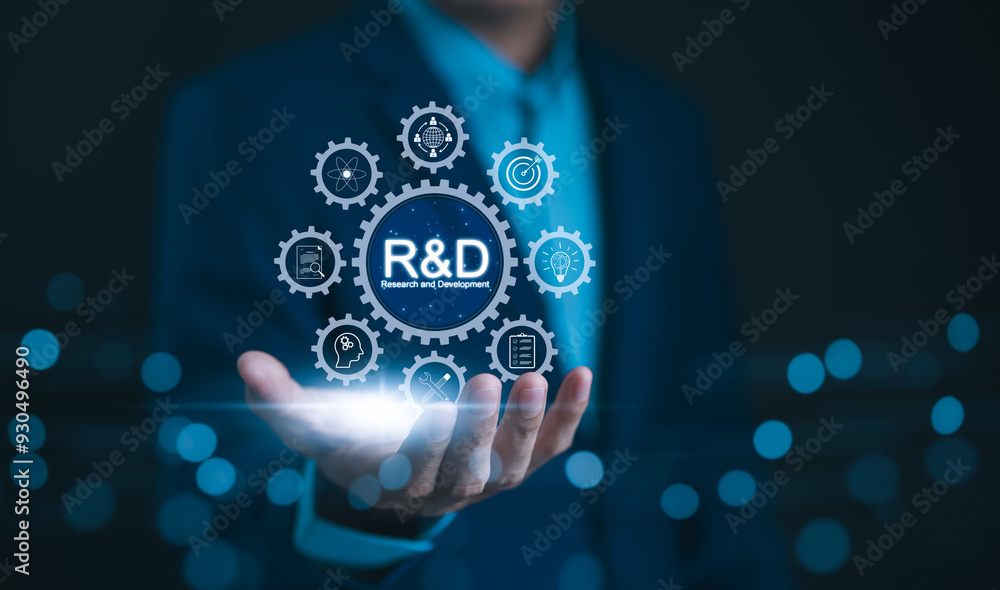 © Supatman - R&D, Research and Development Concept. A businessman holds out his hand, showcasing icons representing research and development. innovation and technological advancements. business solutions, R and D, © Supatman - R&D, Research and Development Concept. A businessman holds out his hand, showcasing icons representing research and development. innovation and technological advancements. business solutions, R and D,