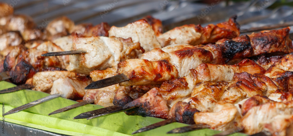 Meat on metal skewers fried on the grill Meat on metal skewers fried on the grill