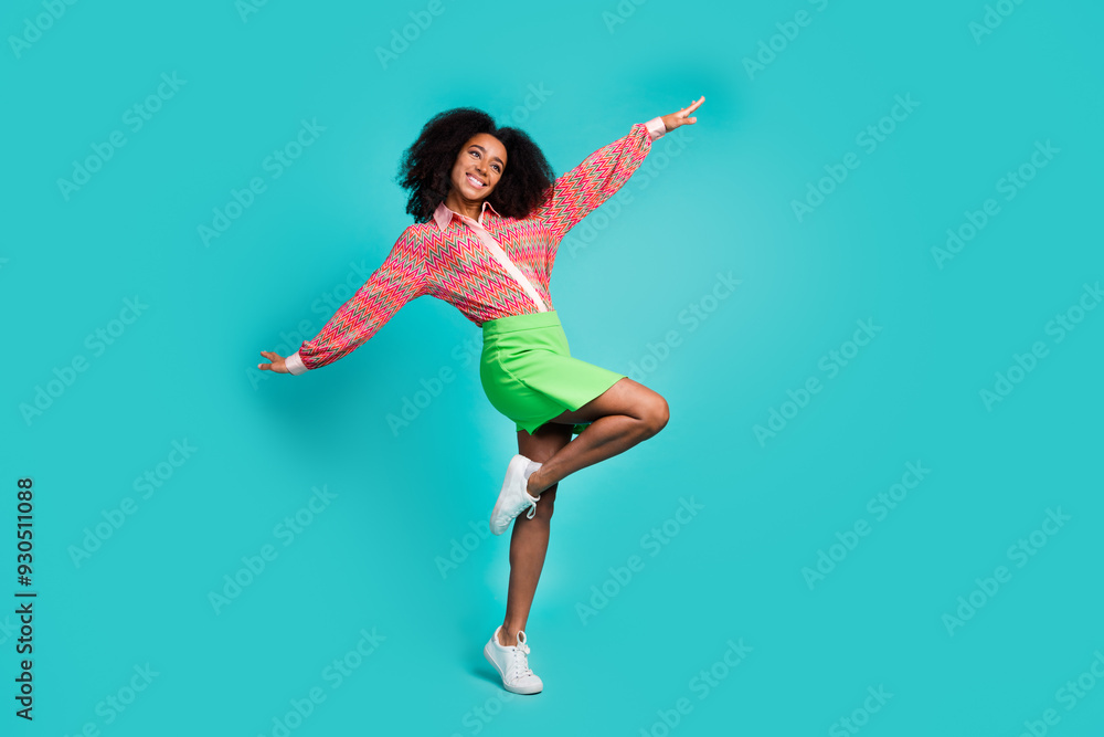 Fototapeta premium Full length photo of charming positive woman wear print shirt having fun empty space isolated turquoise color background