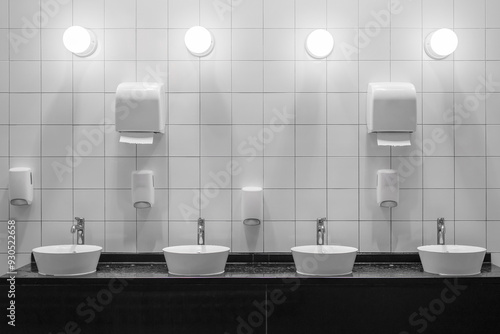 White colour ceramic tiles toilet hand wash area. White colour theme toilet interior. Cleanliness concept. Clean toilet concept.