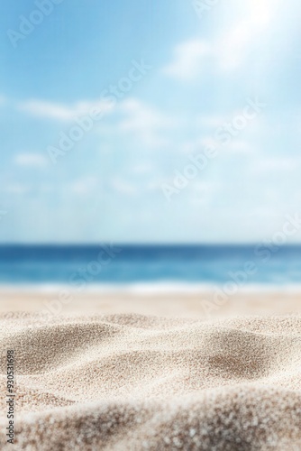 Serene beach scene with soft sand and a calm blue ocean under a bright sky, perfect for themes of relaxation, summer, and tranquility.