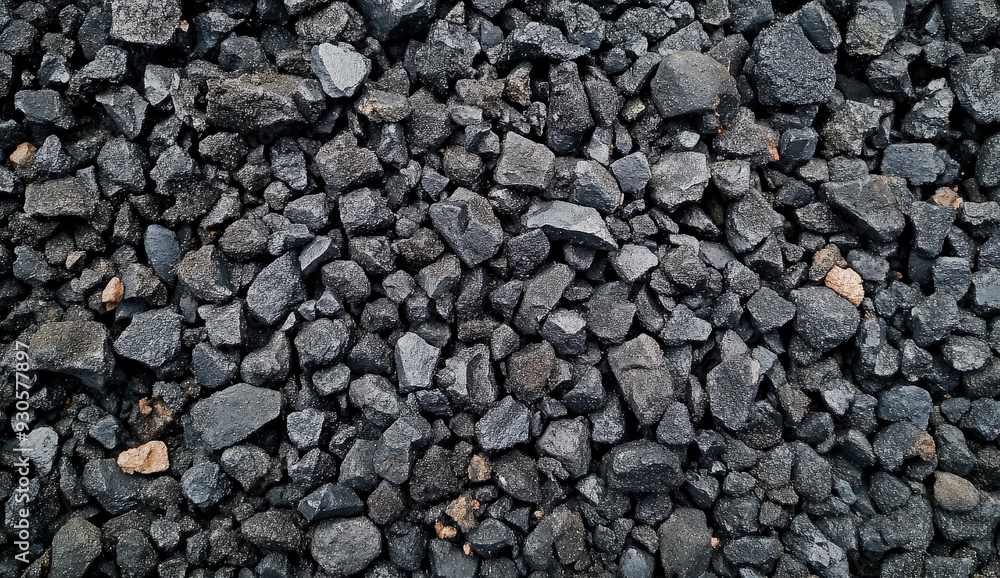 Close-up of a pile of dark grey and black gravel. Close-up of a pile of dark grey and black gravel.