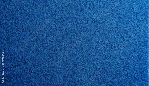 Close-up of a textured blue fabric surface.