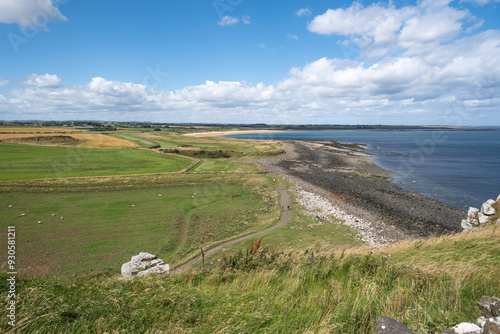 Looking north up the Northumbrian coastline from Dunstanburgh Castle photo