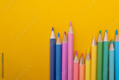 Colored pencils on colored background. Back to school concept. Draw