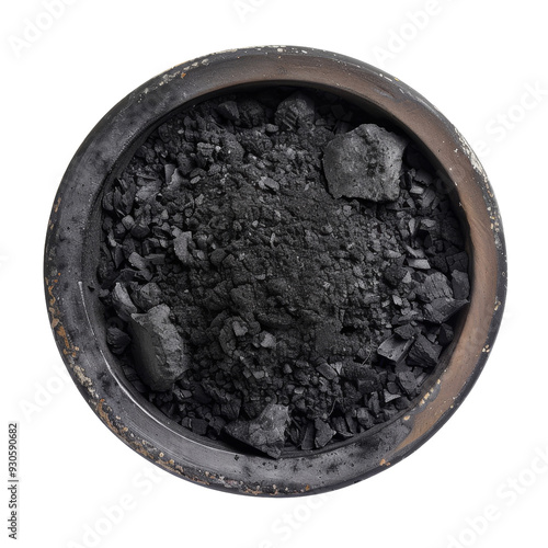 Black charcoal briquettes in a clay bowl, isolated on white background.