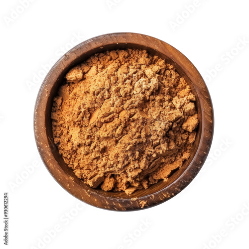 Top view of brown powder in a wooden bowl.