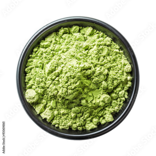 Green powder in a black bowl.