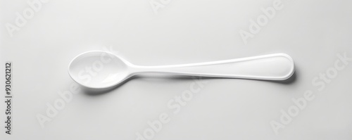 White plastic spoon on white background, 4K hyperrealistic photo photo