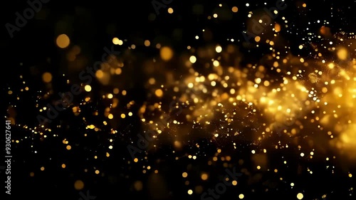 Gold particles in slow motion. Festive glitter background with lights on a black background