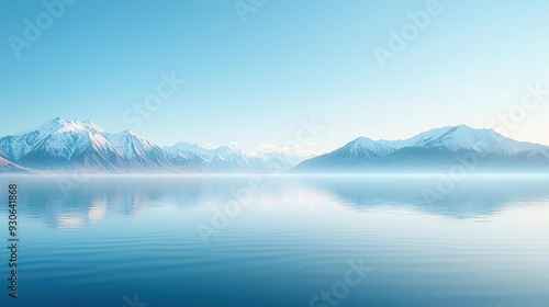 Serene mountain landscape reflected in a calm lake at sunrise.