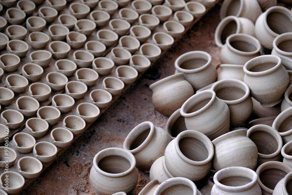 Skilled potter shaping the clay into pot on spinning wheel, Indian earthenware. Skilled potter shaping the clay into pot on spinning wheel, Indian earthenware.