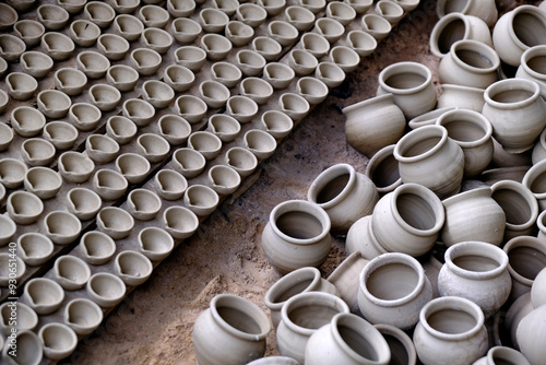 Canvas Print Skilled potter shaping the clay into pot on spinning wheel, Indian earthenware