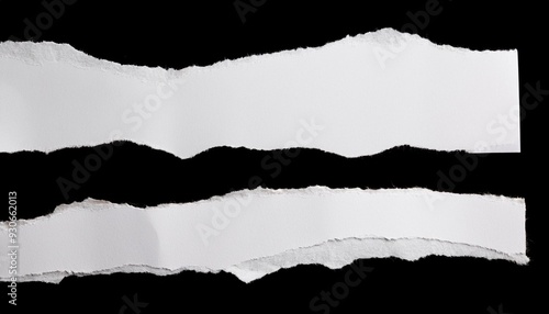 white ripped paper torn edges strips isolated on black background photo