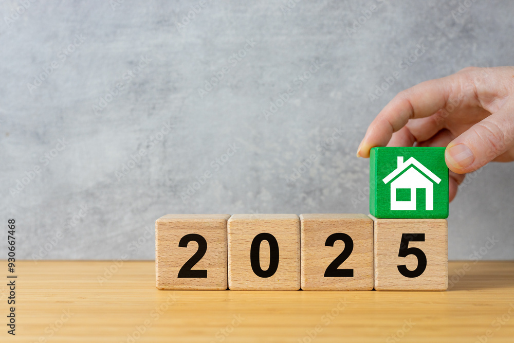 2025. Business and financial concept, market analysis, real estate costs, housing prices, rent a house, Decreasing or rising mortgage rates.Wooden blocks with the year 2025 green with a house icon
