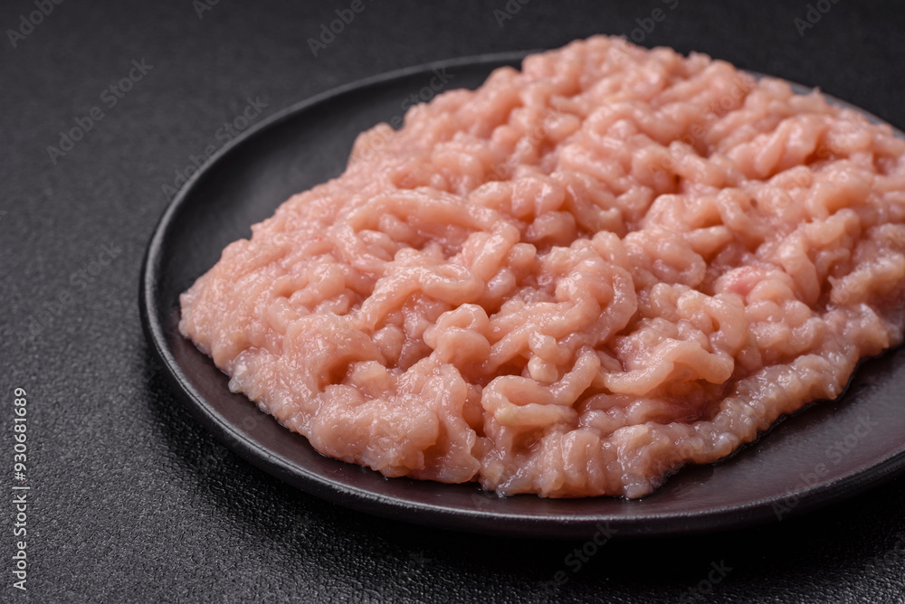 Fresh raw chicken mince with salt and spices Fresh raw chicken mince with salt and spices