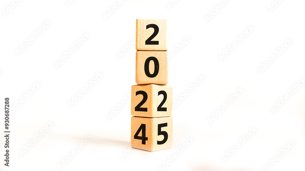 Business concept of 2025 new year symbol. Beautiful turned wooden cube and changed number 2024 to 2025. Beautiful white table white background, copy space. Business 2025 happy new year concept. Business concept of 2025 new year symbol. Beautiful turned wooden cube and changed number 2024 to 2025. Beautiful white table white background, copy space. Business 2025 happy new year concept.