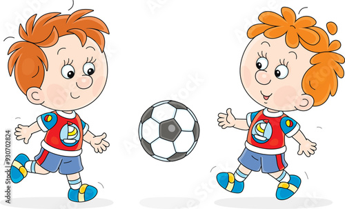 Funny little boys football players playing a ball during a match or train on a sports field, vector cartoon illustration isolated on a white background