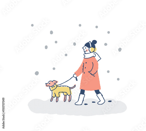 雪の日に犬の散歩をしている女性