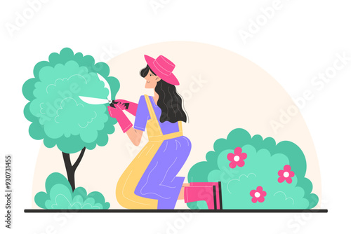A young woman trims bushes in the garden with garden shears